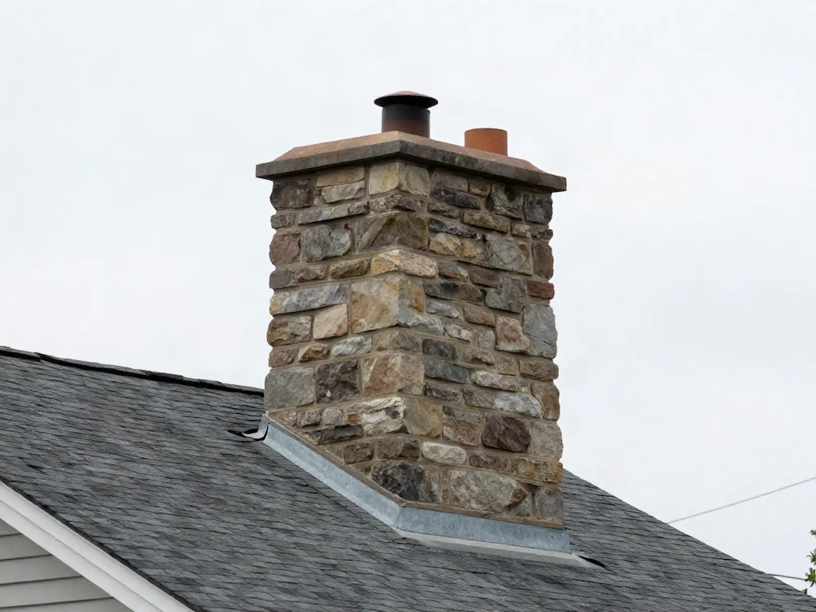 Brick chimney on a home served by Hoskins Brothers Chimney Service in Philadelphia, PA